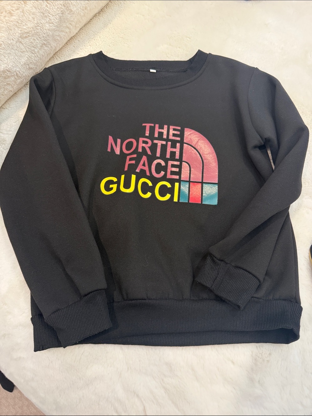 The North Face Black Crewneck Sweatshirt with Pink and Yellow Logo kids 8/10